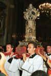 Priests carry the icon containing San Gennaro's blood during the Festival of San Gennaro, where the people of Naples await the miracle which will liquefy the dried blood, demonstarting that the saint still watches over the city.